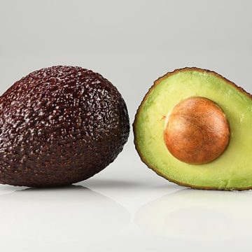 whole and halved Hass avocado: Credit, Wikimedia Commons whole and halved Hass avocado