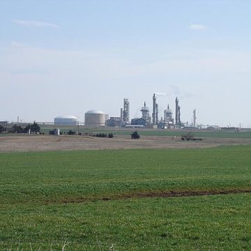 Wheat field flanking a refinery in Oklahoma: Credit, Wikimedia Commons Oklahoma Wheat field