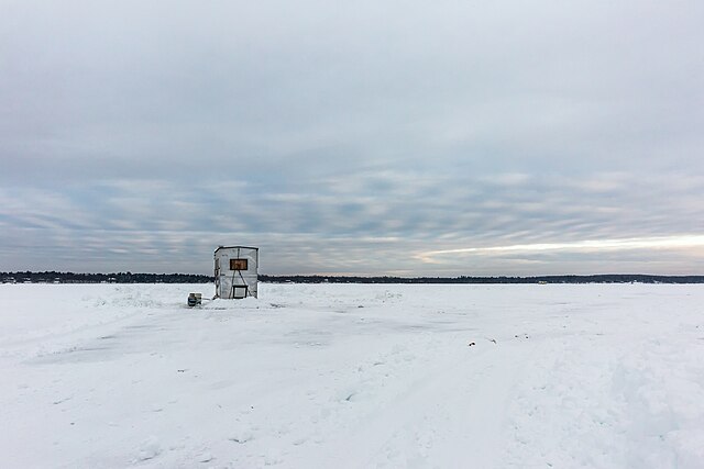 Ice fishing on a lake in the United States: Credit, Wikimedia Commons The northern Iowa ice fishing season begins upon cold spell
